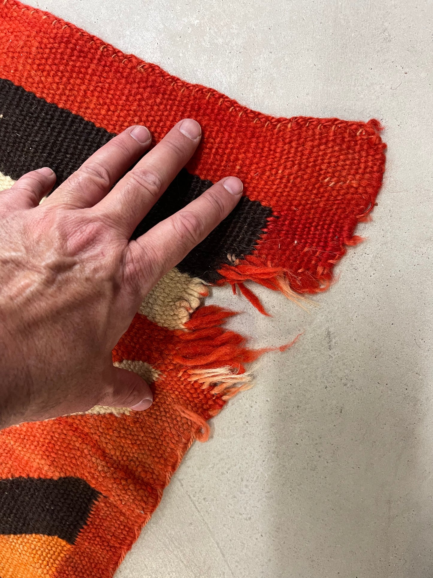 Holes to be repaired on a Navajo Rug