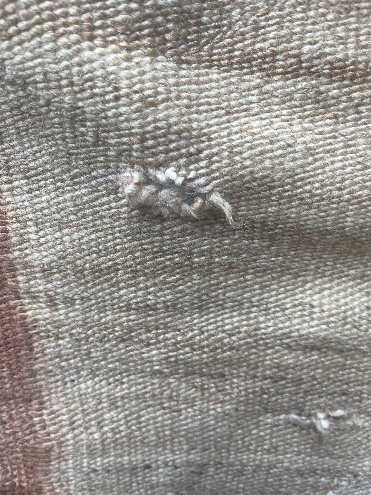 Holes to be repaired on a Navajo Rug