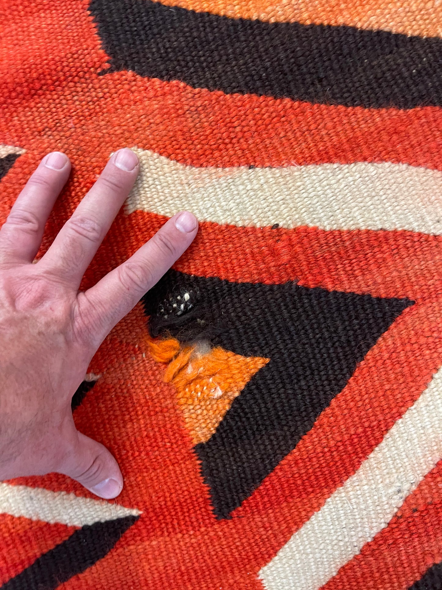 Holes to be repaired on a Navajo Rug