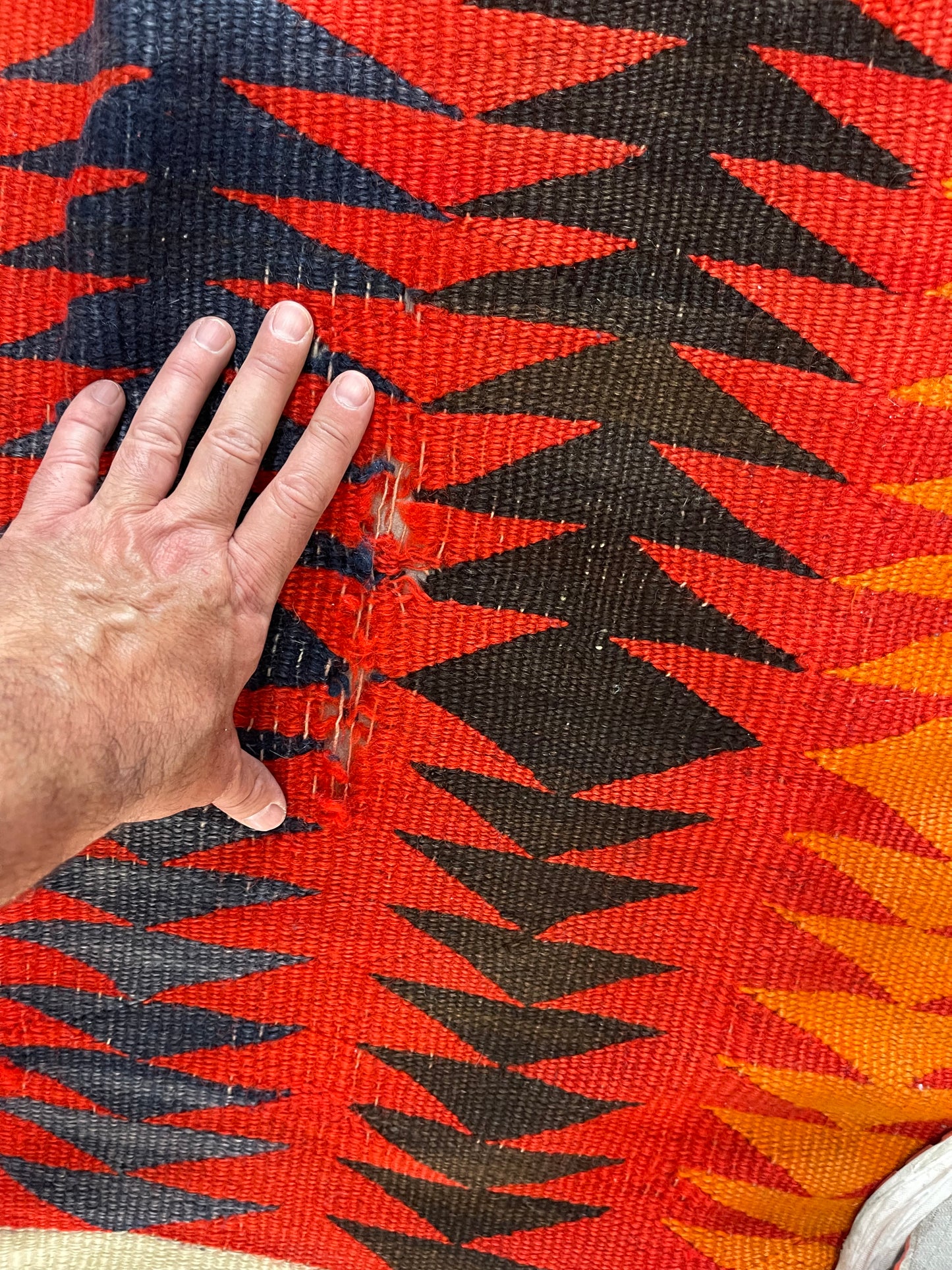 Holes to be repaired on a Navajo Rug