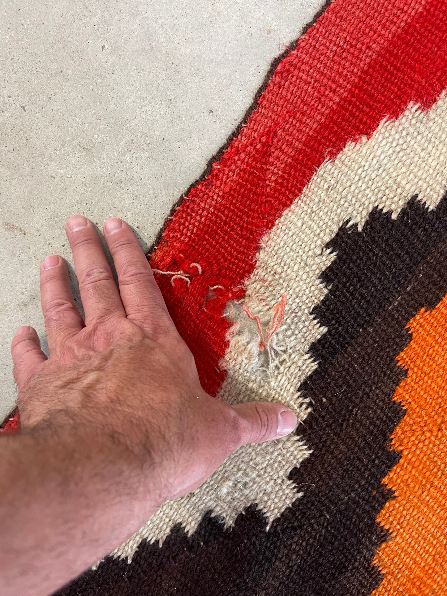 Holes to be repaired on a Navajo Rug