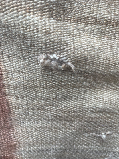 Holes to be repaired on a Navajo Rug