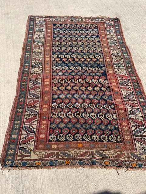 Antique Persian Village rug with navy field and overall Boteh design