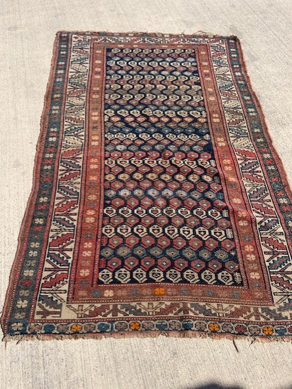 Antique Persian Village rug with navy field and overall Boteh design
