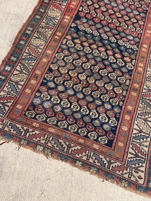 Antique Persian Village rug with navy field and overall Boteh design