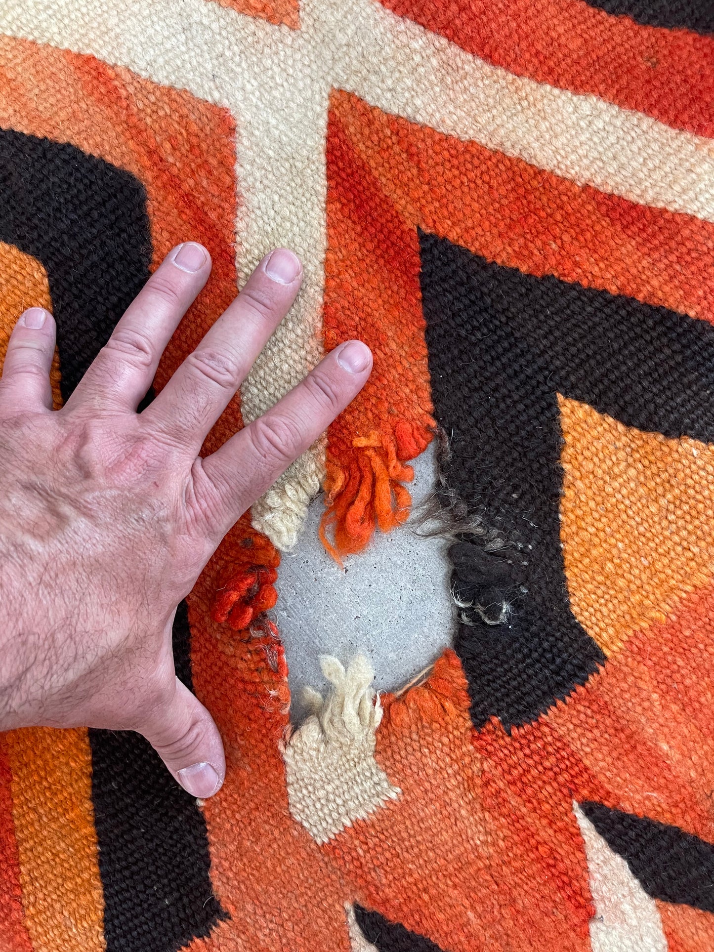 Holes to be repaired on a Navajo Rug