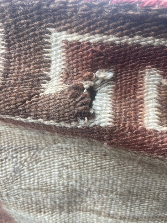 Holes to be repaired on a Navajo Rug