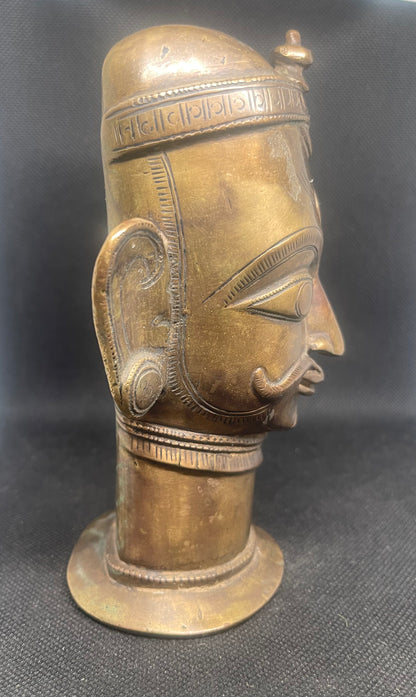 Antique Mukhalinga, depiction of Lord Shiva with beautiful turban,topped by a Linga and sitting on a rare attached base.