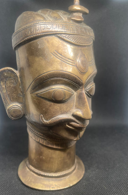 Antique Mukhalinga, depiction of Lord Shiva with beautiful turban,topped by a Linga and sitting on a rare attached base.