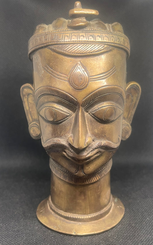 Antique Mukhalinga, depiction of Lord Shiva with beautiful turban,topped by a Linga and sitting on a rare attached base.